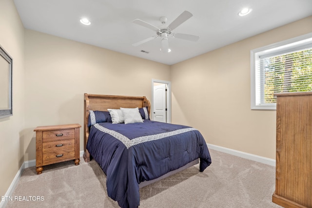 carpeted bedroom featuring baseboards, visible vents, and recessed lighting