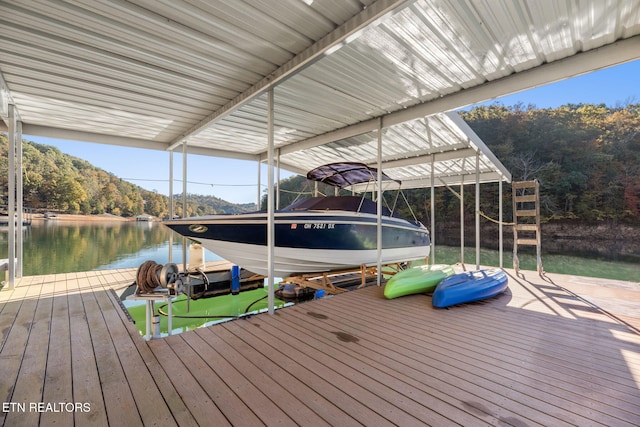 dock area with a water view and boat lift