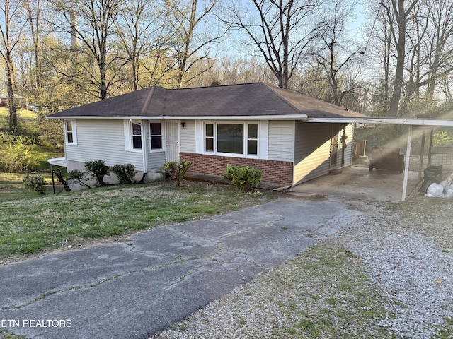 321 Walnut Valley Rd, Clinton, TN 37716 - view of front of home featuring driveway, brick siding, a front lawn, and roof with shingles