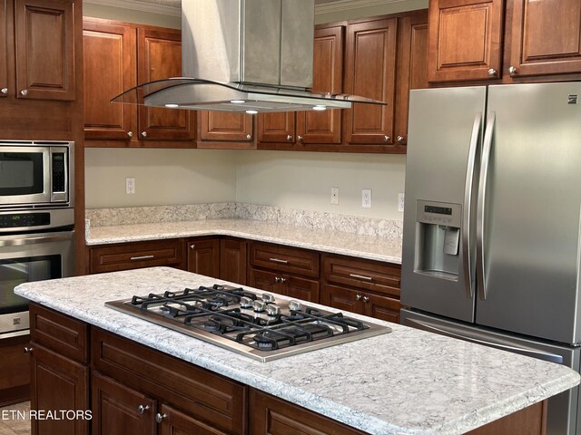 1713 Cardinal Dr, Gatlinburg, TN 37738 - kitchen with light stone countertops, stainless steel appliances, island exhaust hood, a kitchen island, and ornamental molding
