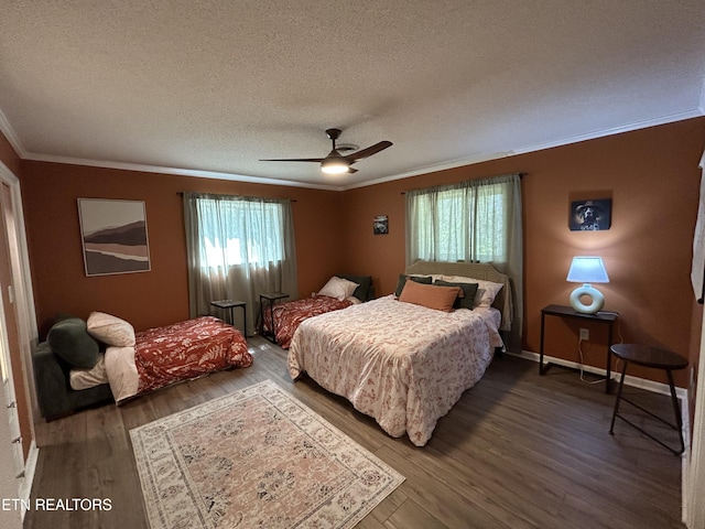 1713 Cardinal Dr, Gatlinburg, TN 37738 - bedroom with ornamental molding, a textured ceiling, and multiple windows