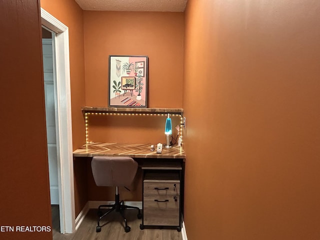 1713 Cardinal Dr, Gatlinburg, TN 37738 - office featuring a textured ceiling, wood finished floors, and baseboards