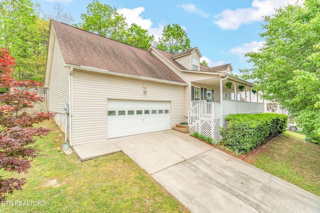 new england style home featuring covered porch, driveway, roof with shingles, a garage, and a front lawn