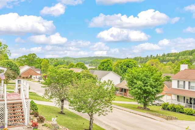 birds eye view of property with a residential view