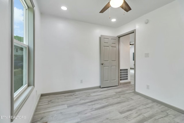 spare room with a ceiling fan, baseboards, recessed lighting, and light wood-style floors