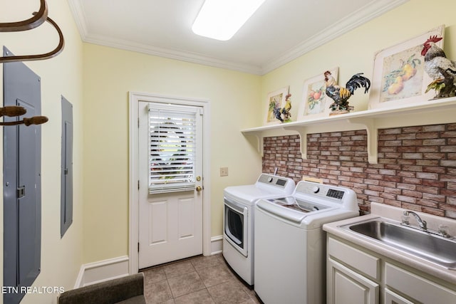 laundry area with washer and dryer, ornamental molding, a sink, and cabinet space