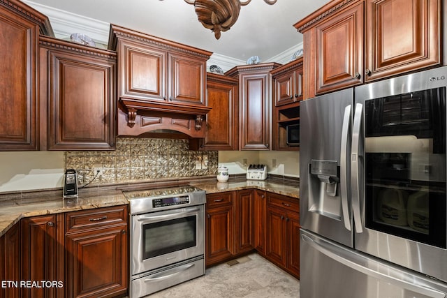 kitchen featuring backsplash, crown molding, light stone countertops, premium range hood, and stainless steel appliances