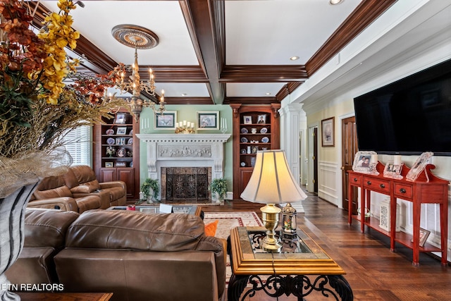 living area featuring beam ceiling, ornamental molding, built in shelves, and a fireplace