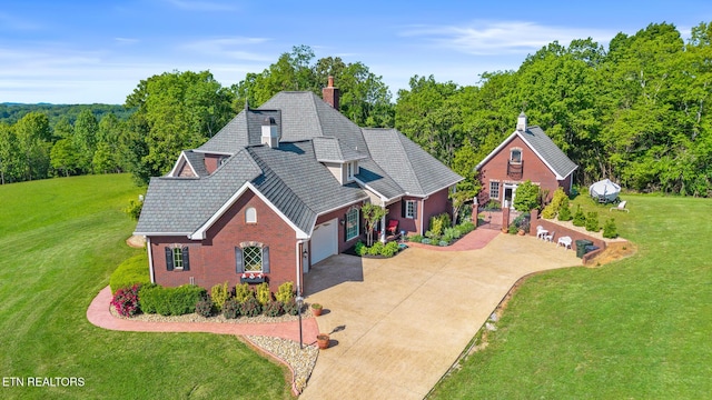 drone / aerial view with a view of trees