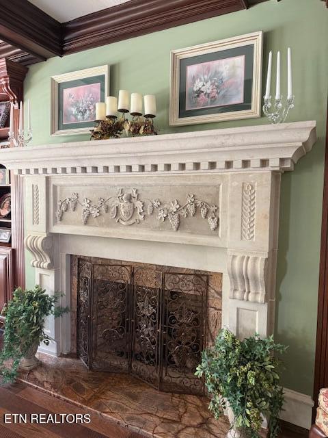 interior details with ornamental molding and wood finished floors