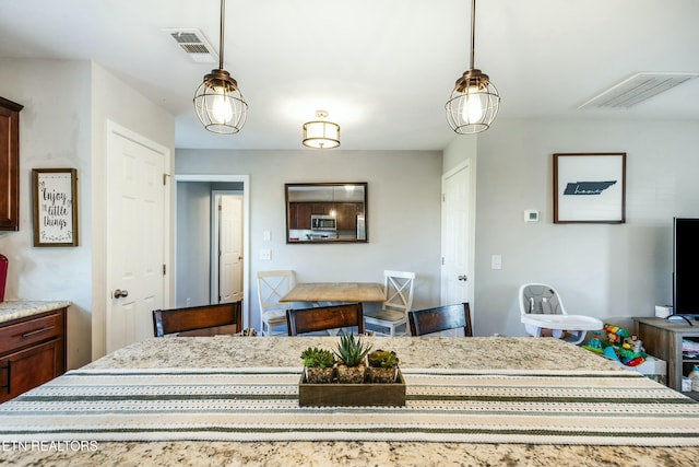 dining room with visible vents