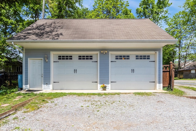 detached garage with fence