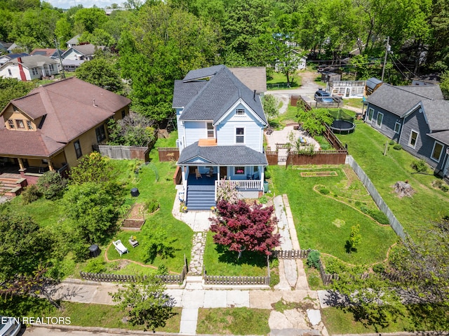 birds eye view of property with a residential view