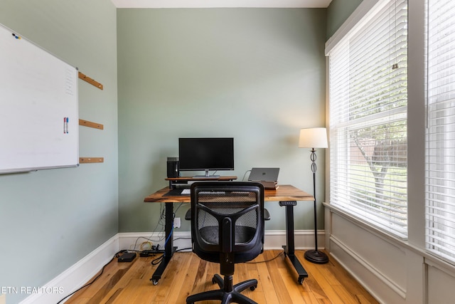 office with wood finished floors and baseboards