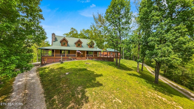 761 N Knob Creek Rd, Seymour, TN 37865 - farmhouse inspired home featuring covered porch, a front yard, and a chimney