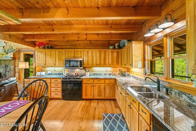 761 N Knob Creek Rd, Seymour, TN 37865 - kitchen with stainless steel microwave, range with gas cooktop, a sink, wooden ceiling with exposed beams, and light wood finished floors