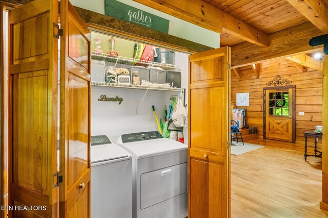 761 N Knob Creek Rd, Seymour, TN 37865 - laundry area featuring separate washer and dryer, light wood-type flooring, wood walls, and wooden ceiling