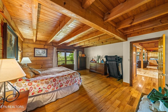 761 N Knob Creek Rd, Seymour, TN 37865 - bedroom featuring wooden ceiling with exposed beams, hardwood / wood-style flooring, wooden walls, and access to exterior