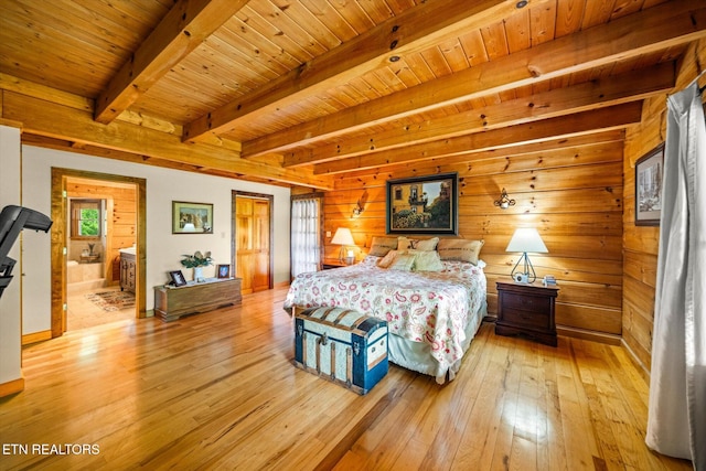 761 N Knob Creek Rd, Seymour, TN 37865 - bedroom featuring light wood-style floors, wooden ceiling with exposed beams, wood walls, and connected bathroom