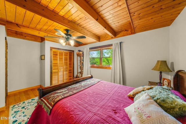 761 N Knob Creek Rd, Seymour, TN 37865 - bedroom with wood ceiling with exposed beams, wood finished floors, baseboards, a ceiling fan, and a closet