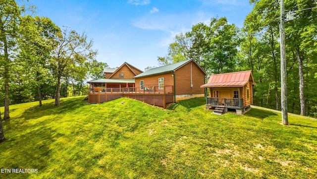 761 N Knob Creek Rd, Seymour, TN 37865 - back of house with a lawn, metal roof, a standing seam roof, and a deck