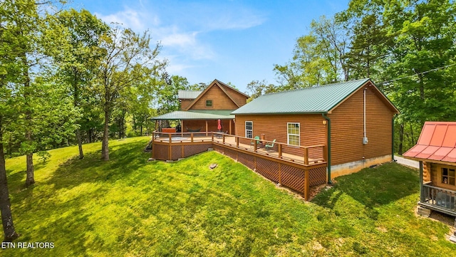 761 N Knob Creek Rd, Seymour, TN 37865 - back of property with a yard, metal roof, and a wooden deck