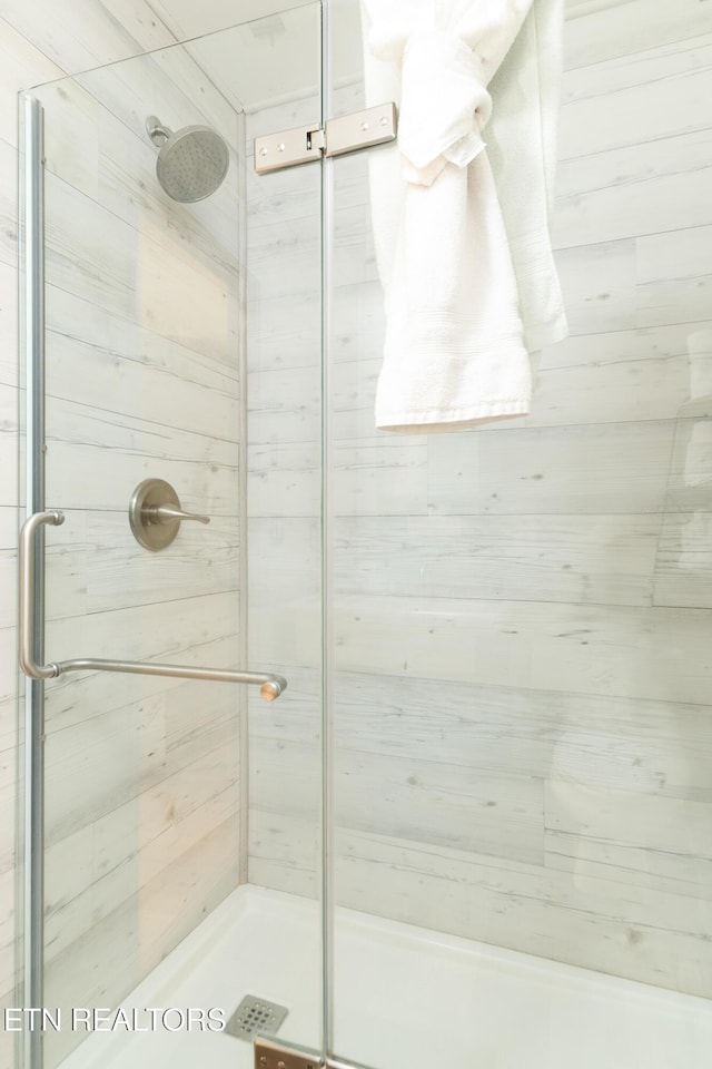 full bathroom with a shower stall
