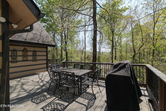 wooden deck with outdoor dining area