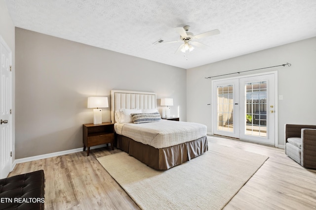 bedroom with french doors, access to exterior, baseboards, a ceiling fan, and wood finished floors