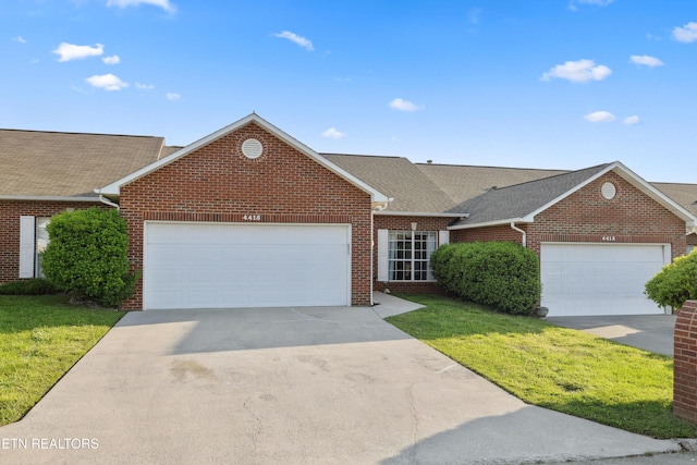 ranch-style home with an attached garage, brick siding, and a front yard