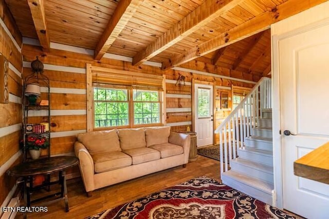 living room with wood ceiling, stairs, wood finished floors, and beamed ceiling