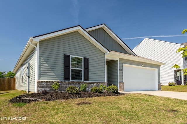 1423 Ridge Estates Dr, Athens, TN 37303 - view of front of home featuring an attached garage, concrete driveway, board and batten siding, and brick siding