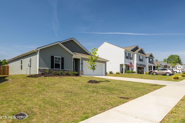 1423 Ridge Estates Dr, Athens, TN 37303 - view of front of property with an attached garage, driveway, a front yard, a residential view, and board and batten siding