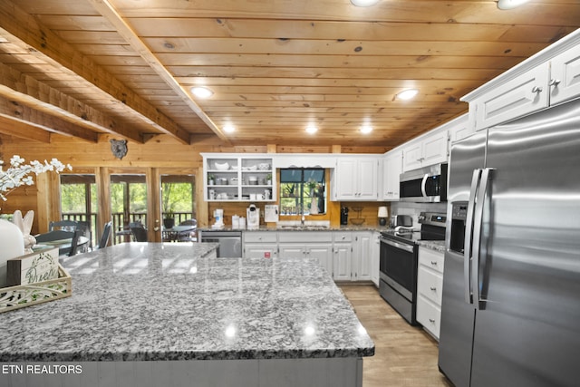 kitchen with white cabinets, stainless steel appliances, wooden ceiling, and light wood-style flooring