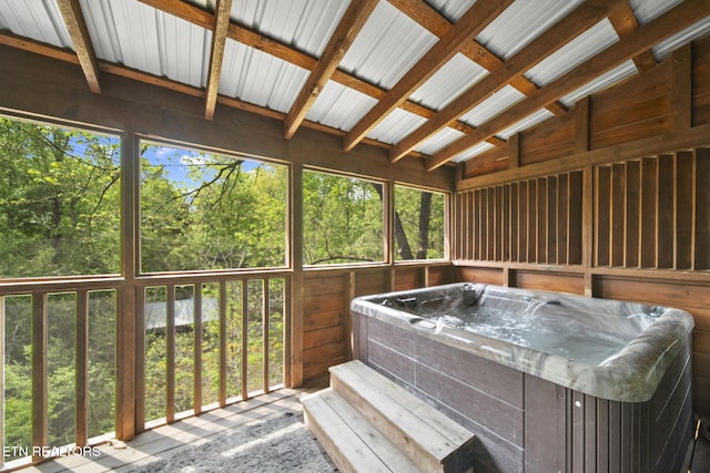 sunroom featuring a jacuzzi