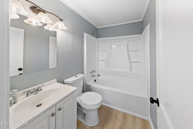 full bathroom featuring bathtub / shower combination, wood finished floors, vanity, and toilet