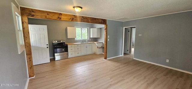 kitchen featuring white cabinets, stainless steel electric range, a textured ceiling, and light wood finished floors