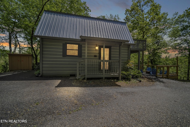 901 Sunrise Blvd, Sevierville, TN 37862 - rustic home featuring an outbuilding, metal roof, and a shed