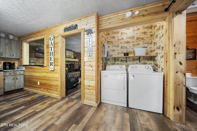901 Sunrise Blvd, Sevierville, TN 37862 - washroom with dark wood finished floors, washer and dryer, and wooden walls