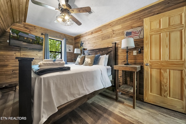 901 Sunrise Blvd, Sevierville, TN 37862 - bedroom with a ceiling fan, wood walls, and wood finished floors