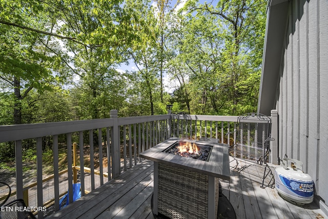 901 Sunrise Blvd, Sevierville, TN 37862 - wooden deck with an outdoor fire pit
