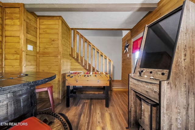 901 Sunrise Blvd, Sevierville, TN 37862 - staircase with wood walls, wood finished floors, and beam ceiling