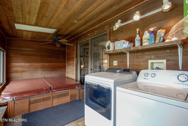 laundry room with independent washer and dryer, laundry area, ceiling fan, wood walls, and wooden ceiling
