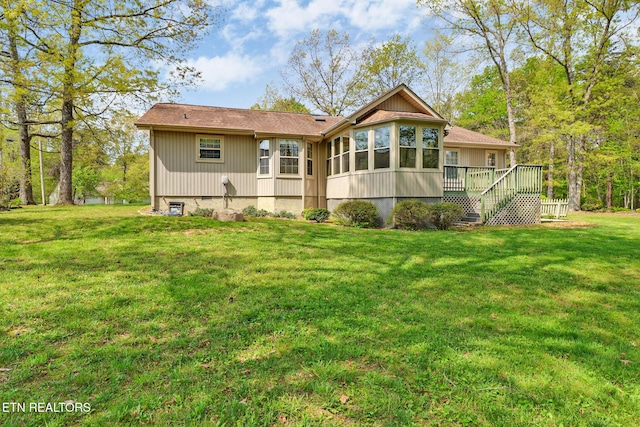 11 Windsor Pt, Crossville, TN 38558 - back of property with a sunroom, a yard, stairs, and a deck