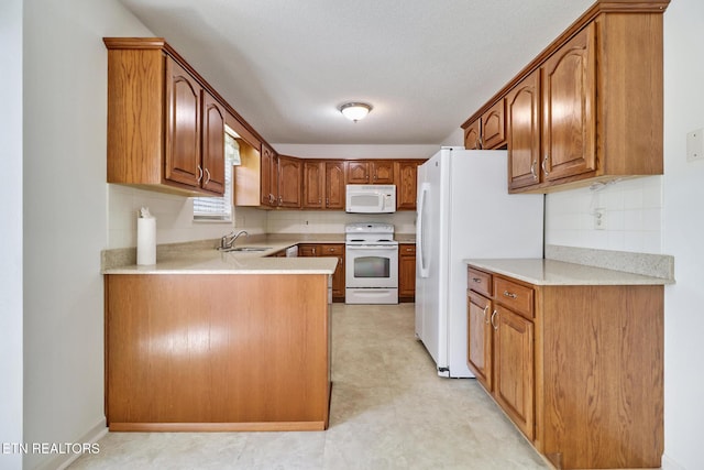 11 Windsor Pt, Crossville, TN 38558 - kitchen featuring a sink, brown cabinets, white appliances, and light countertops