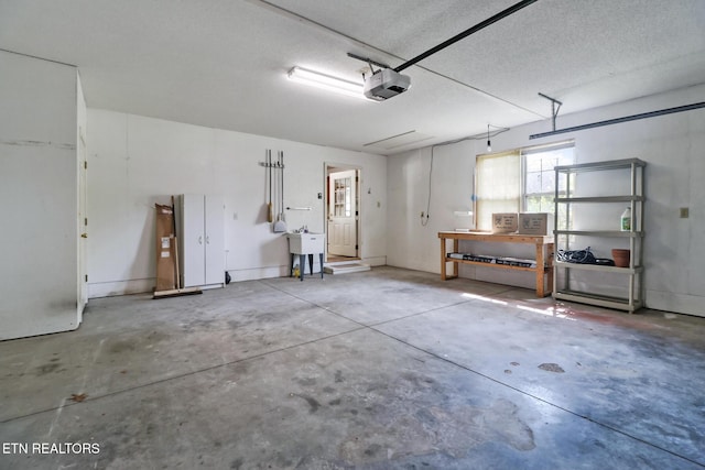 11 Windsor Pt, Crossville, TN 38558 - garage featuring a sink and a garage door opener