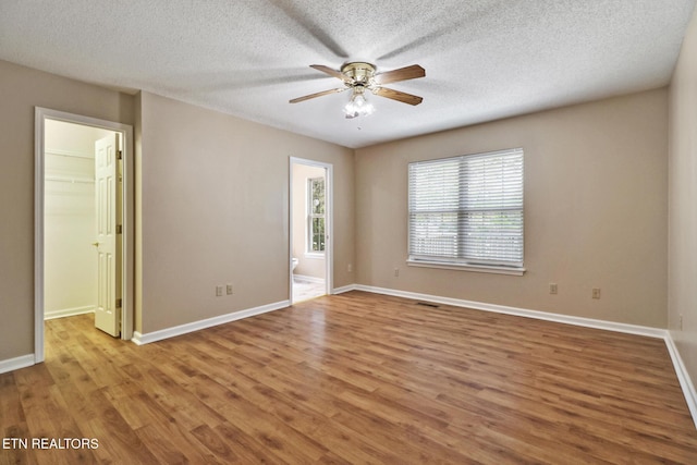11 Windsor Pt, Crossville, TN 38558 - unfurnished room featuring baseboards, a textured ceiling, ceiling fan, and wood finished floors