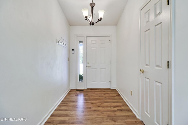 11 Windsor Pt, Crossville, TN 38558 - entrance foyer featuring baseboards, an inviting chandelier, and wood finished floors