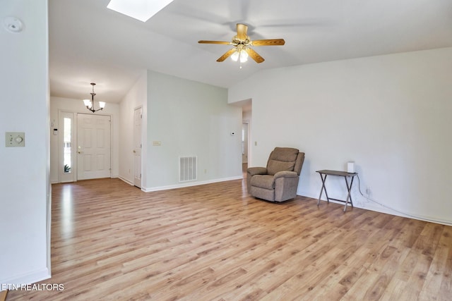 11 Windsor Pt, Crossville, TN 38558 - unfurnished room with a skylight, visible vents, ceiling fan with notable chandelier, and light wood-style floors
