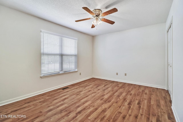 11 Windsor Pt, Crossville, TN 38558 - spare room featuring ceiling fan, a textured ceiling, visible vents, wood finished floors, and baseboards